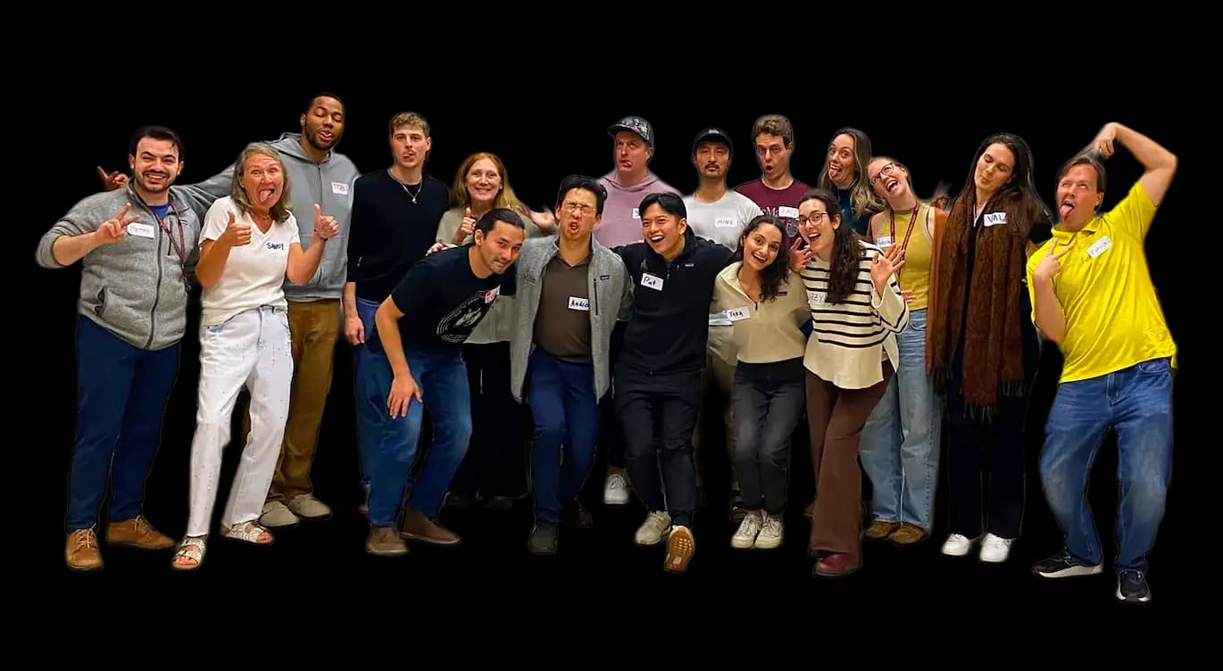 Participants smiling after a Railway City Improv corporate workshop
